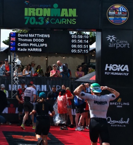 Kade Harris crossing the Ironman 70.3 Cairns finish line